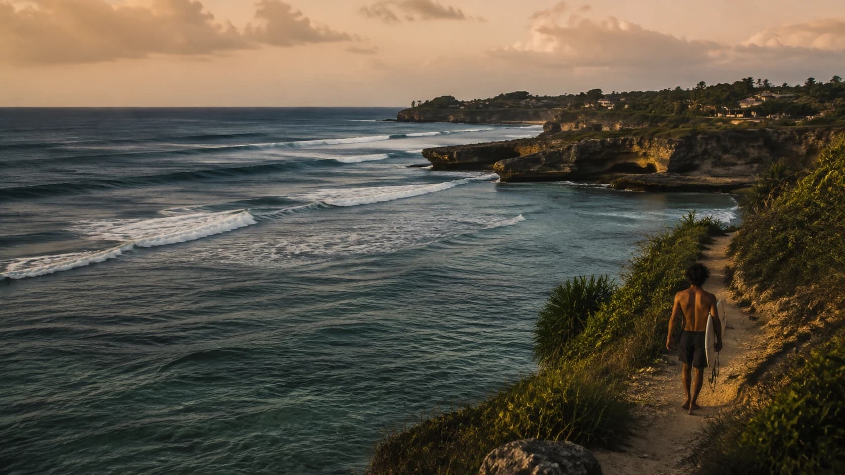 Surfer berjalan di jalur pesisir di atas ombak reef Indonesia saat golden hour